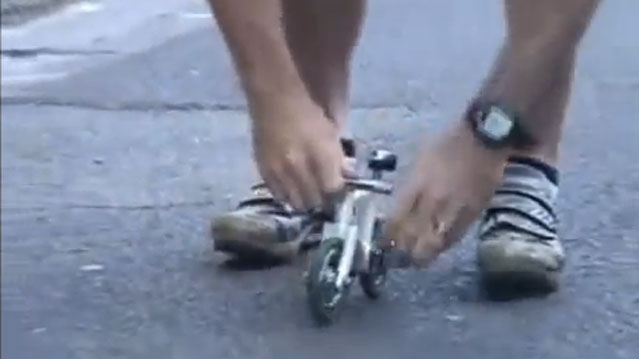 Man Rides The Smallest Bike In The World