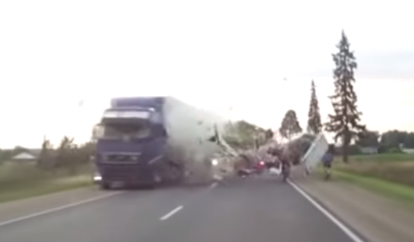 Cyclist nearly hit when Semi's Collide!